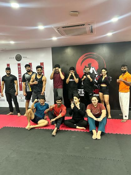 A relaxed group photo after a tough training session. The camaraderie is evident.