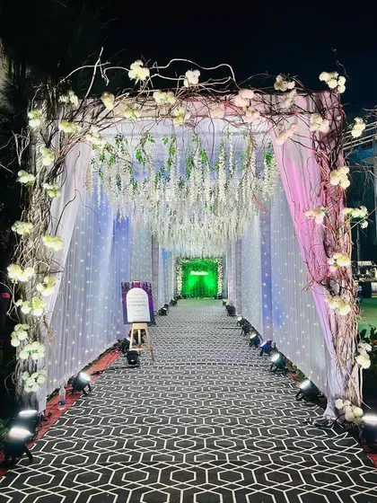 Another shot of the enchanting wisteria and branch entrance, showcasing the beautiful lighting effect.