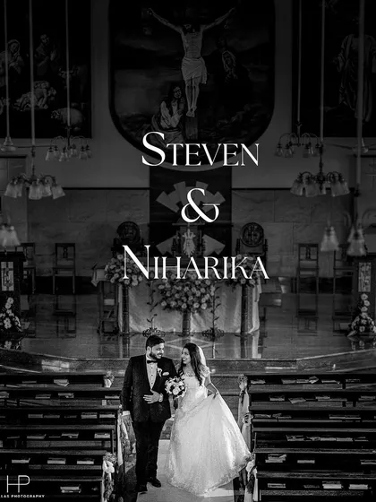 A classic black and white portrait of Steven and Niharika walking down the aisle after their Christian wedding ceremony. This timeless style emphasizes the emotion and solemnity of the moment.
