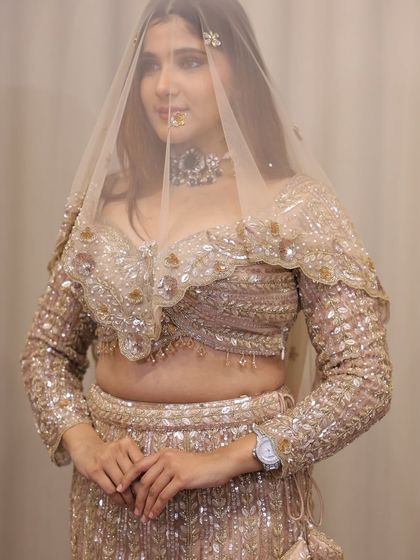 A close-up with the dupatta as a veil. This shows how a modern cocktail outfit can still have a touch of traditional elegance.