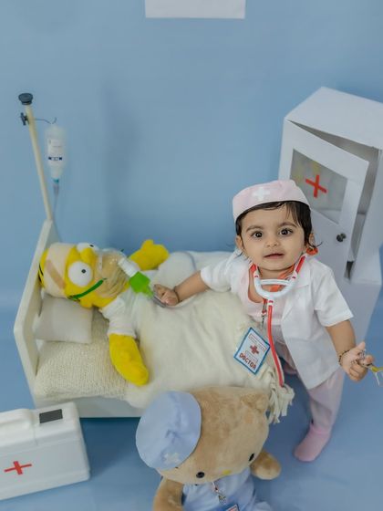 Dr. Happy making her rounds, checking on her patient in this adorable themed setup.