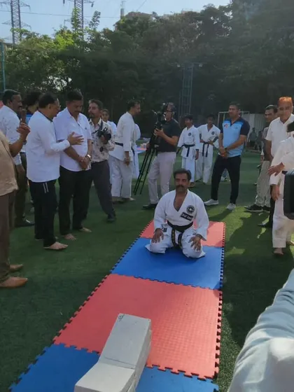 A moment of focus and meditation before attempting to smash cement blocks with my head. Mental preparation is just as critical as physical training for these high-risk stunts.