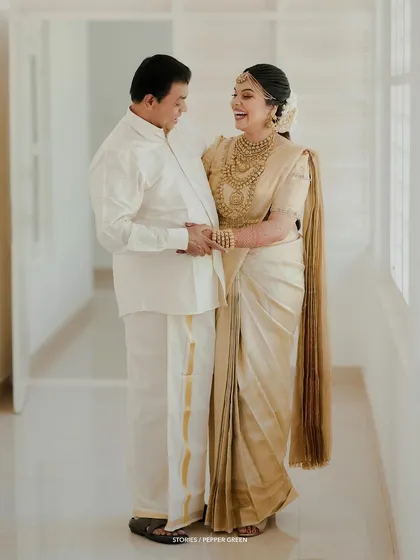 A happy portrait of the bride and her father, their shared smile a beautiful moment to cherish.