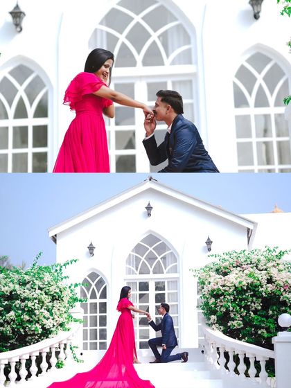 A classic proposal moment captured on the steps of a beautiful white chapel-like structure, creating a perfect fairytale image.