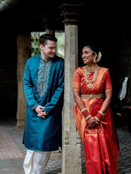 A stolen glance between pillars. This shot uses the architecture to create a sense of intimacy and a feeling of discovering a private moment.