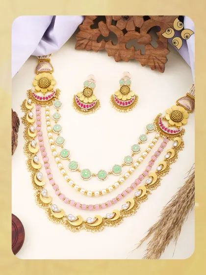 A closer look at our pastel-toned multi-layered necklace. The combination of pearls, coloured beads, and gold floral motifs creates a fresh, contemporary piece with wide appeal.