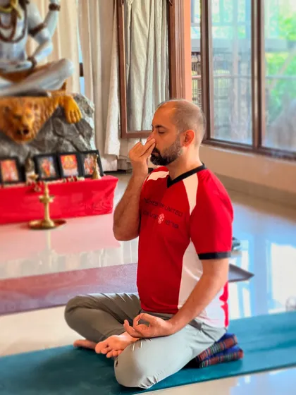 A student practices pranayama in front of our altar. The serene environment of our center helps to deepen the meditative experience.