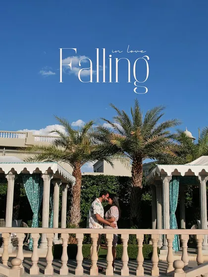A beautiful, sunny day at a palace resort provides the perfect backdrop for this romantic pre-wedding portrait. The palm trees and cabanas add a touch of tropical luxury.