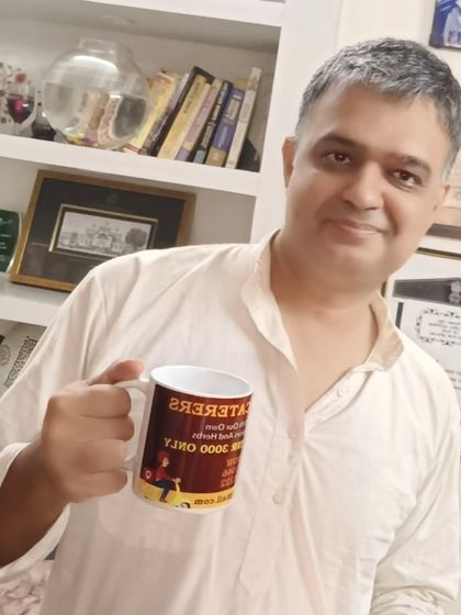A happy customer enjoying his morning tea in a mug gifted by us. We love it when our clients remember us.