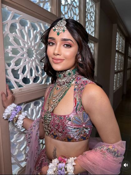 Another beautiful shot of the model from the masterclass, showing the elegance of the floral half-updo.