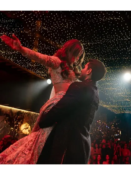 Alya and Shivaan soar during their first dance, under a sky of starry lights. This romantic and dynamic shot captures the magic of the moment.