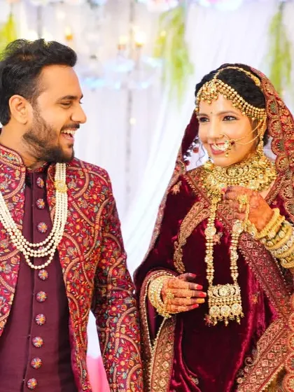 The couple shares a happy and loving glance, captured candidly during their wedding festivities.