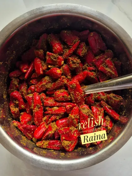 This bowl shows my Stuffed Red Chilli Pickle during preparation. These vibrant red chillies are available only in winter, and I stuff them with a traditional North Indian masala. The process is time-consuming, but the spicy, robust flavour of the final pickle is worth the effort.