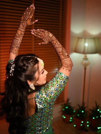 A graceful pose from my mehendi bride. Her braided hairstyle and glowing makeup complete the look.