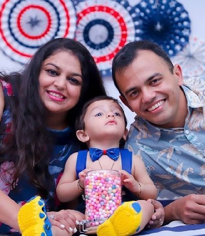 A happy family portrait celebrating their son's first birthday. We make sure to include parents in the celebration for a complete set of memories.