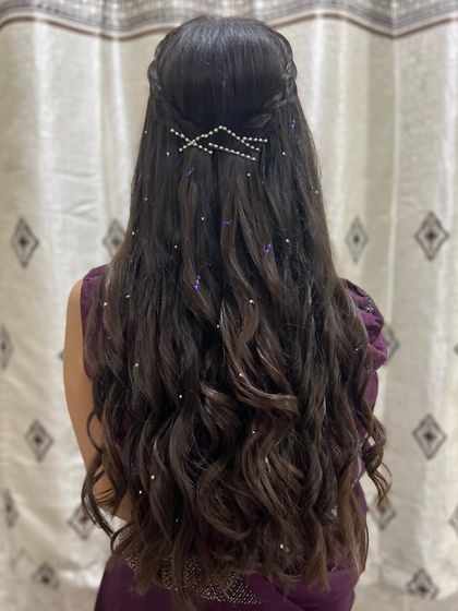 The same beautiful hairstyle from a slightly different angle, showing the distribution of the pearl accessories.