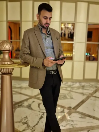 A client looking sharp and composed in a custom-tailored brown blazer and patterned shirt. I focus on the finest fabrics to create pieces that embody comfort, durability, and individual style.