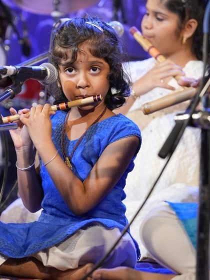 One of our youngest flute students, showing incredible poise and concentration during her performance.