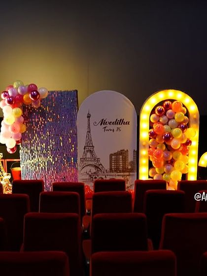 The magical glow of the Paris-themed decor in the dark theatre, creating an unforgettable ambiance.