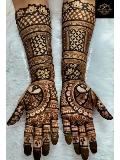 This full-hand design was created for a bridesmaid. It features a blend of classic Indian mehndi elements like peacocks, lotuses, and elegant check patterns for a rich, celebratory look.