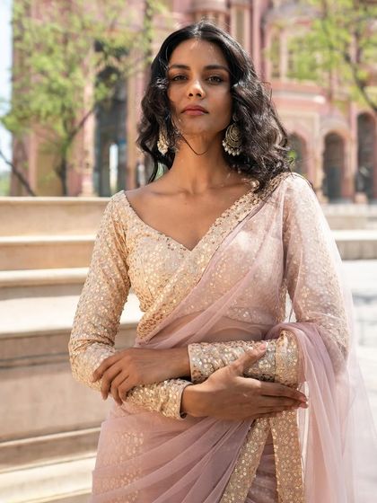 Another look at our refreshing pale peach pre-stitched saree with a full-sleeve sequin blouse.