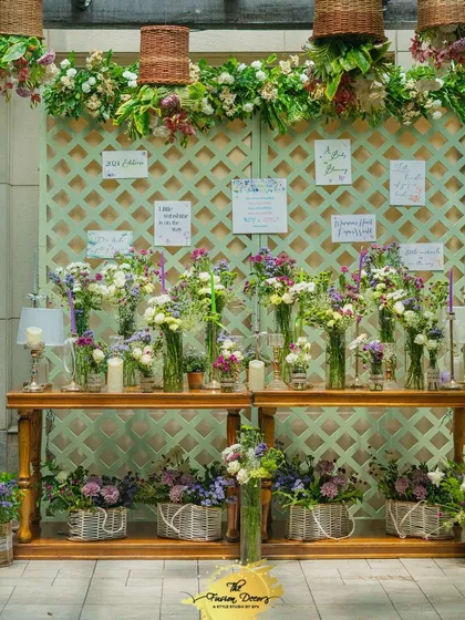An interactive "Bloom Bar" where guests could create their own small bouquets as a party favor. This is a wonderful way to engage guests and add a personal, floral touch to the celebration.