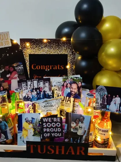 Say 'Congratulations' in a big way with this black and gold themed hamper. It's perfect for celebrating a major achievement, complete with Corona beers, fairy lights, and lots of personal photos.