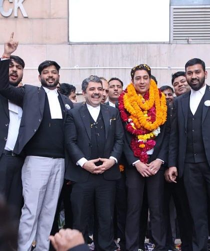 Celebrating with my colleagues outside the court complex. Their enthusiasm and dedication throughout the campaign for the bar association election were the foundation of our success.