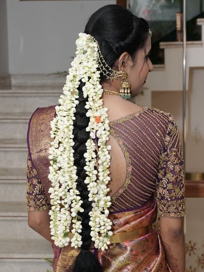 A picture-perfect family celebrating their housewarming. I had the pleasure of dressing my client Archana in a hand-worked blouse, her husband in a custom shirt, and their son in a charming Kalamkari kurta.