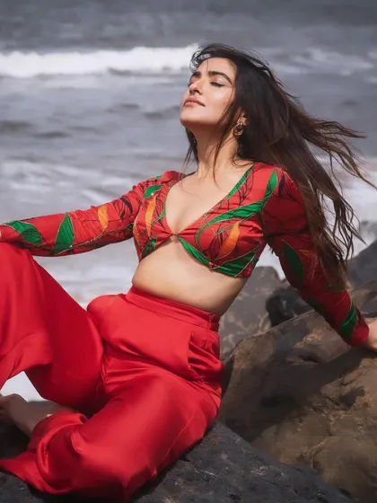 Soaking up the sun during a beach photoshoot. The makeup here is all about a natural, healthy glow that looks like second skin, paired with a simple nude lip.