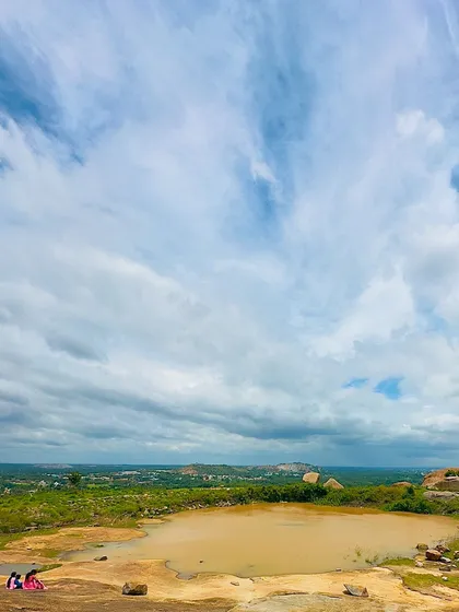 A small pond on the rocky terrain of Mandaragiri Hill.