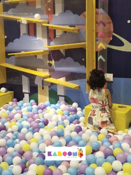 Exploring the ball maze! This little one is fascinated by our wall-mounted ball run, a great activity for developing problem-solving skills.