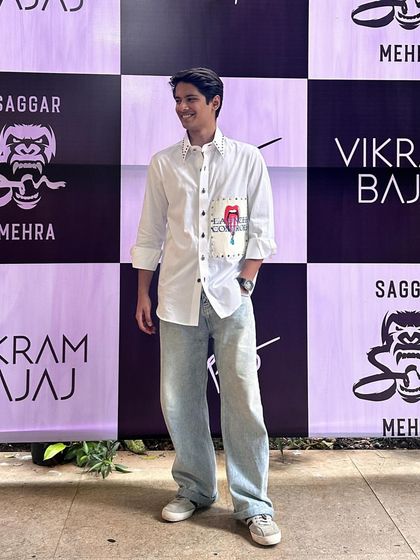 Sam Kothi showcases contemporary flair in the Elysian Set. The holographic printed patch and embroidered detailing on this light pink cotton shirt elevate his casual wear.