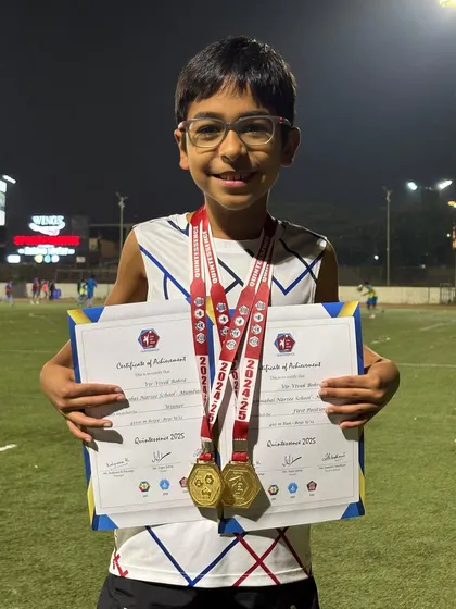 Vir Bohra with his certificates and two gold medals for the 400m and 4x100m relay. His hard work and team spirit shine through.