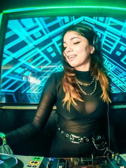 A shot from a techno-focused set. The green and blue lights create a futuristic vibe, perfect for diving into some deeper electronic music.