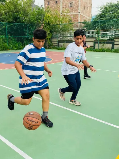 A young player practices his dribbling skills.