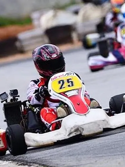 An action shot from the Indian Rotax Championship, where our driver in kart 25 battles for position against a competitor.