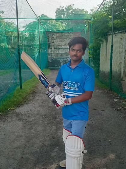 A young batsman posing with his new bat. The right gear can make a big difference to a player's confidence and performance.