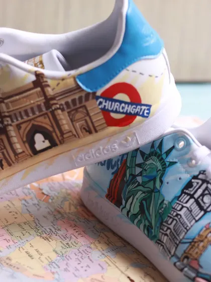 A detail shot showing the Churchgate station sign and the London bridge on the travel-themed custom.
