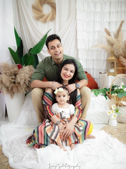 A fun and happy family portrait celebrating their baby girl. I love capturing the unique dynamic of each family, from tender moments to playful smiles.