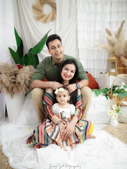A fun and happy family portrait celebrating their baby girl. I love capturing the unique dynamic of each family, from tender moments to playful smiles.