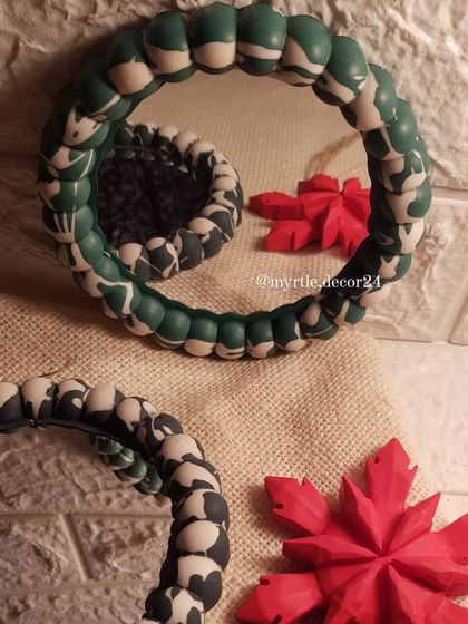 We also make these fun Bubble Mirrors with a festive twist. Here, we've used a marbled green and white and a black and white pattern, perfect for a modern Christmas theme.