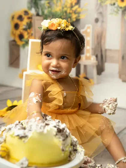 That happy, frosting-covered smile says it all. I love capturing the aftermath of a successful cakesmash, where every crumb tells a story of birthday fun.