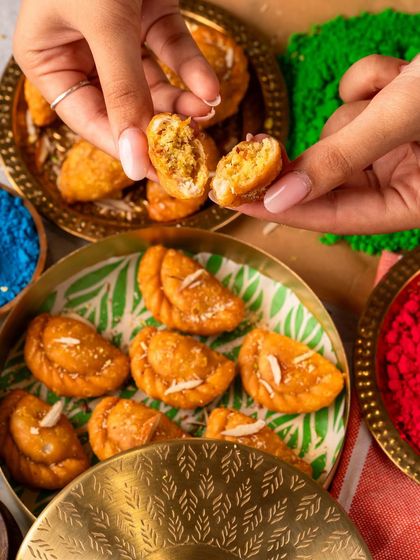 A closer look at the heart of my Holi special, the Gujiya. The flaky pastry gives way to a sweet, aromatic filling of khoya and nuts, a texture and taste that defines the festival.