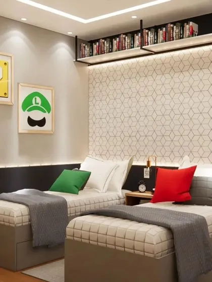 A closer look at the twin beds with their colorful cushions. The backlit bookshelf provides a warm glow and a stylish storage solution.