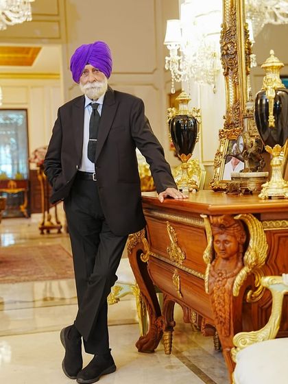 Posed in a stately room, His Highness exudes elegance. Our goal is to create clothing that feels like a natural extension of the wearer's own persona.