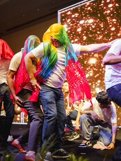 Using props to add color and fun! We love incorporating elements like these colorful dupattas to make a groomsmen performance even more entertaining.