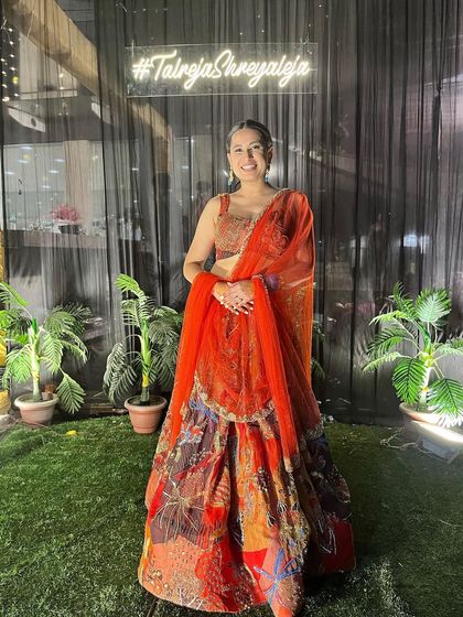 Here I am wearing a popular Aisha Rao lehenga. This shows clients that I am familiar with current designer trends and can source these high-fashion pieces for them.