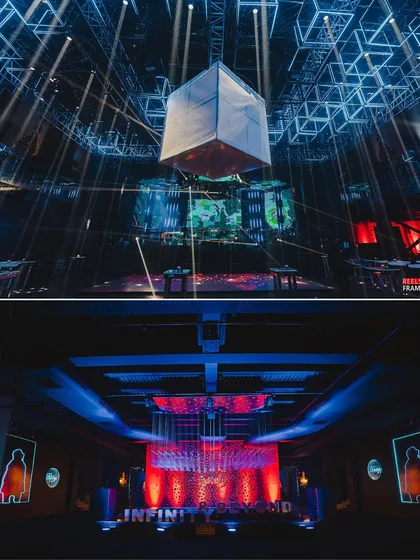 A glimpse into the 'Infinity and Beyond' party's production, showing the floating cube centerpiece and the striking red and blue lighting design. No detail is overlooked when we design a world of its own.