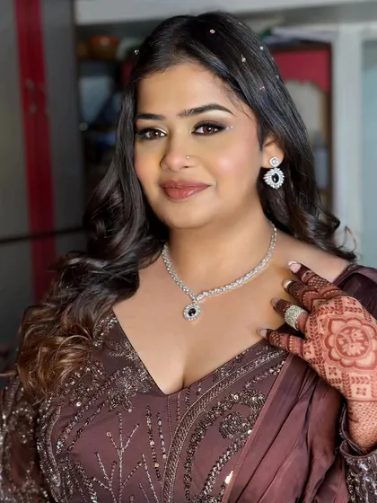 A full-face shot showing the beautiful, glowing skin and perfectly blended makeup. She is ready for her sangeet night.